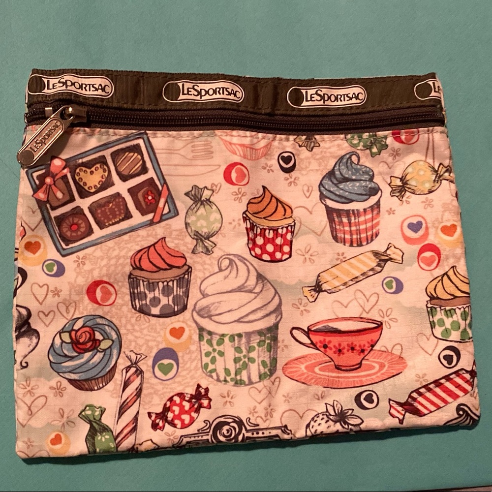 Le Sportsac flat pouch.  Cupcakes and sweets design - so cute.